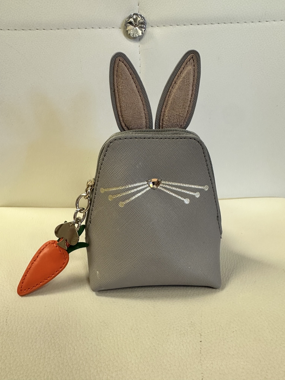 kate spade Gray Bunny Ear Cosmetic Pouch with Orange Carrot Charm